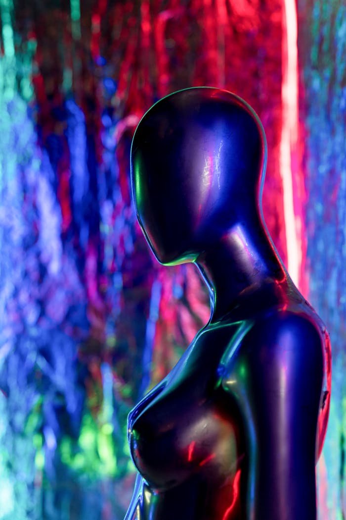 Black mannequin with neon lights in a cyberpunk style setting, exuding a techno vibe.
